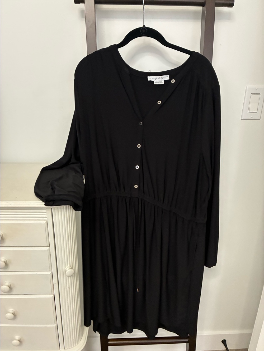 Penningtons classic black dress  buttons down front. Elastic waist. Long sleeve